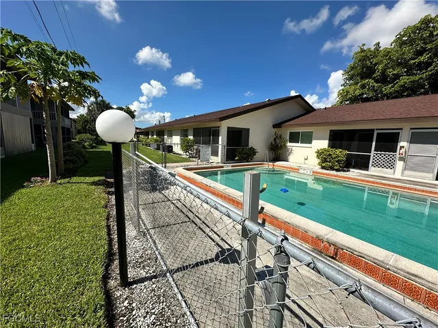 a front view of a house with garden and porch