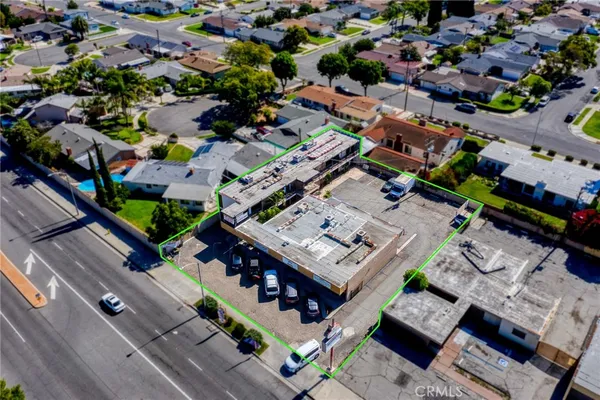 an aerial view of a city with lots of residential buildings and green space