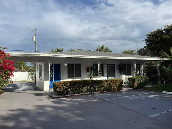front view of a house with a garden