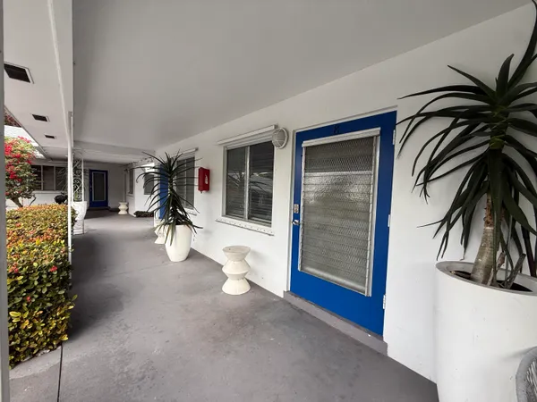 a view of a room with gym equipment and floor to ceiling window