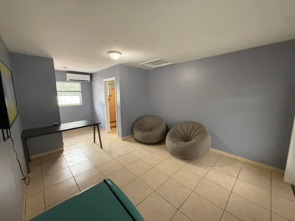 a living room with furniture and a window