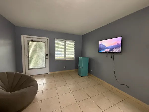 a view of an empty room with a window