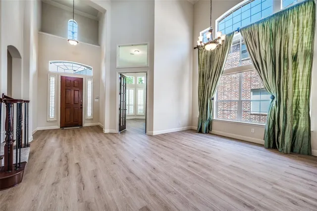 a view of a house with wooden floor and stairs