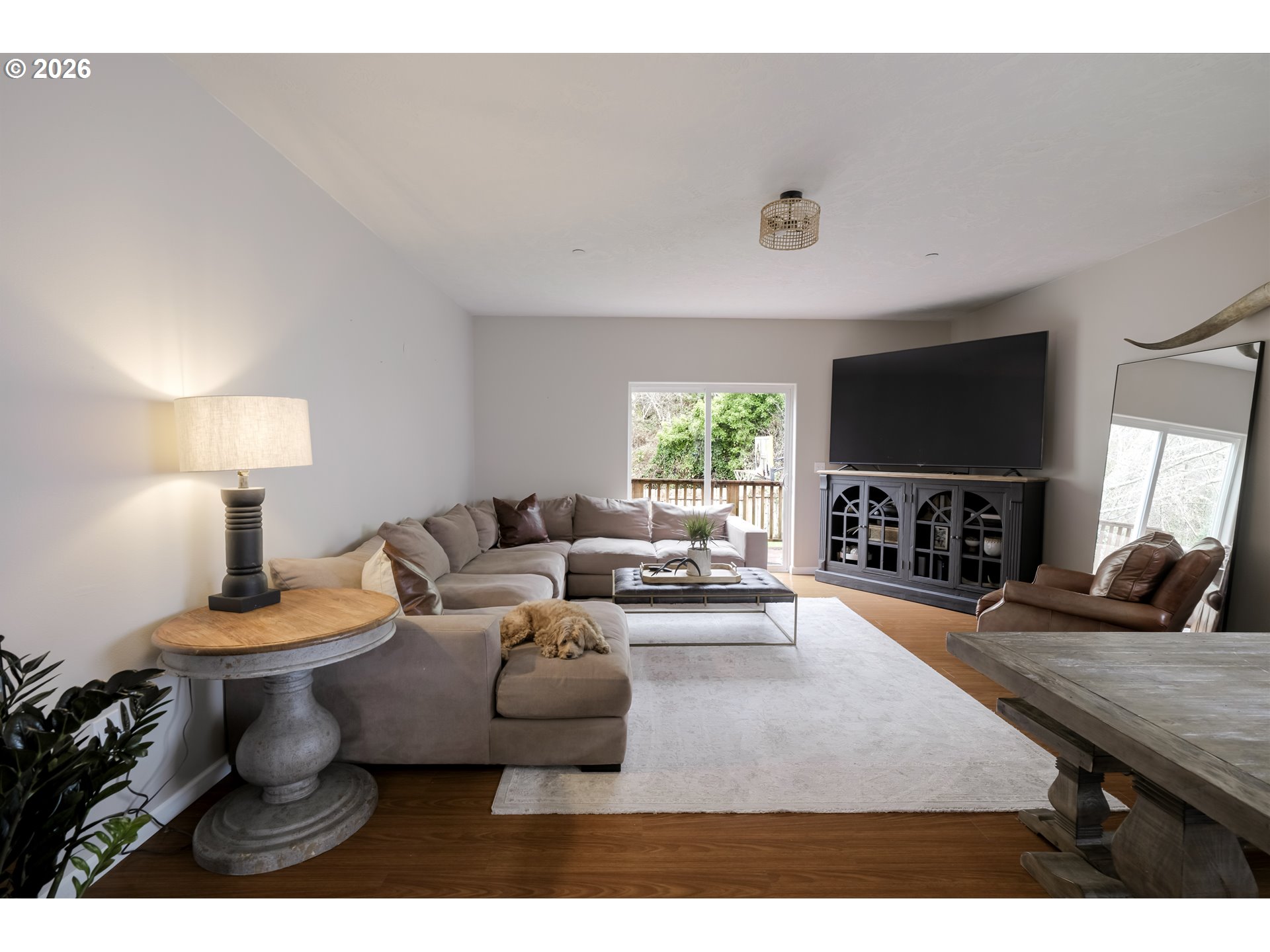 1732 Southeast 3rd Street Astoria, OR 97103 - Photo 13 of 30 a living room with furniture and a flat screen tv