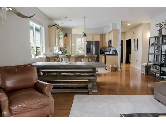 a living room with kitchen view and a couch