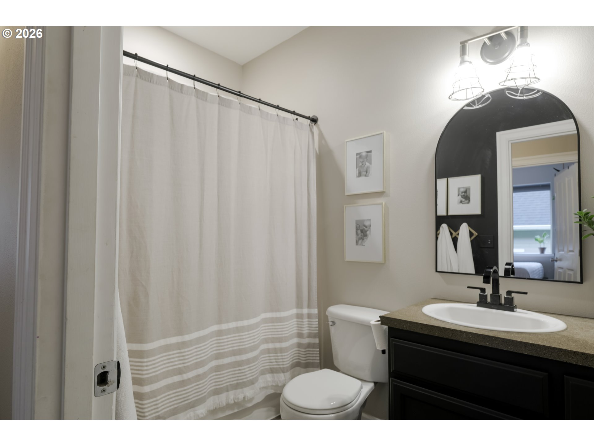 1732 Southeast 3rd Street Astoria, OR 97103 - Photo 16 of 30 a bathroom with a sink a mirror and a toilet
