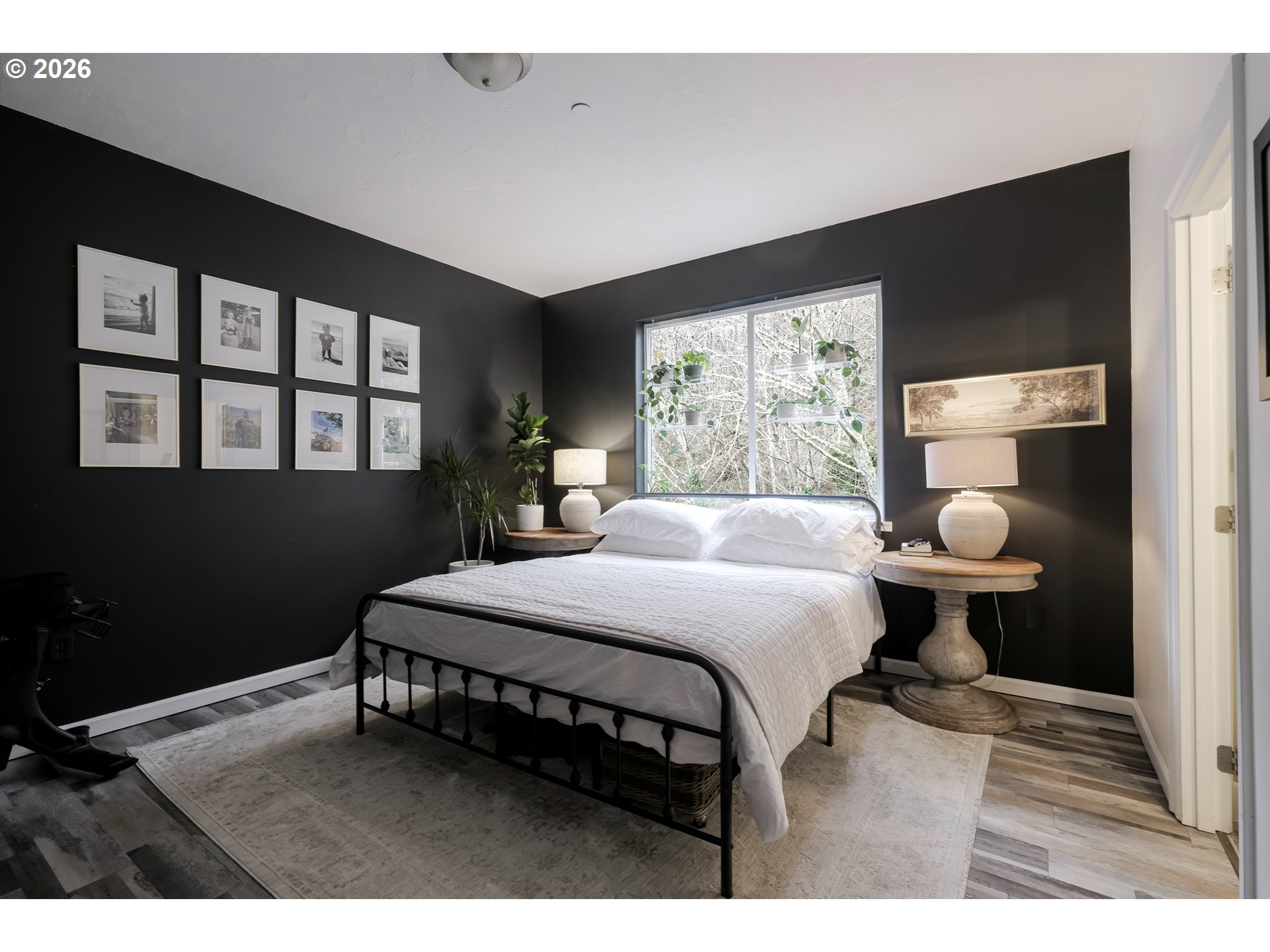 1732 Southeast 3rd Street Astoria, OR 97103 - Photo 18 of 30 a bedroom with a bed wooden floor and window