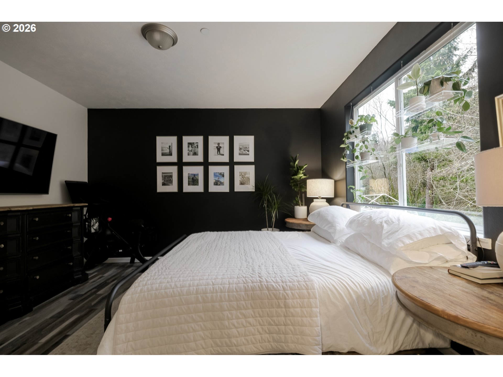 1732 Southeast 3rd Street Astoria, OR 97103 - Photo 19 of 30 a bedroom with a bed and a large window