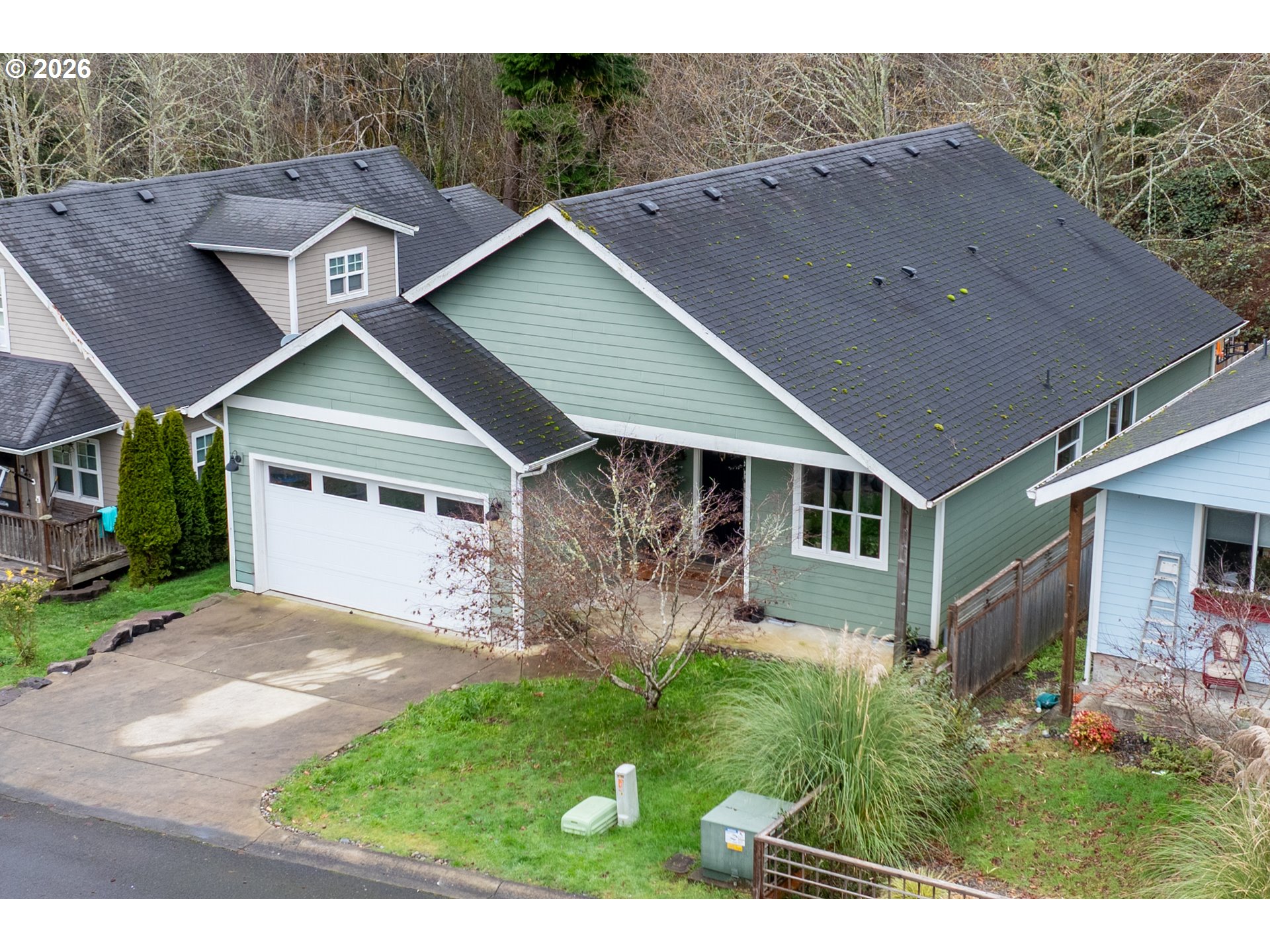 1732 Southeast 3rd Street Astoria, OR 97103 - Photo 28 of 30 a aerial view of a house with a big yard potted plants and large tree