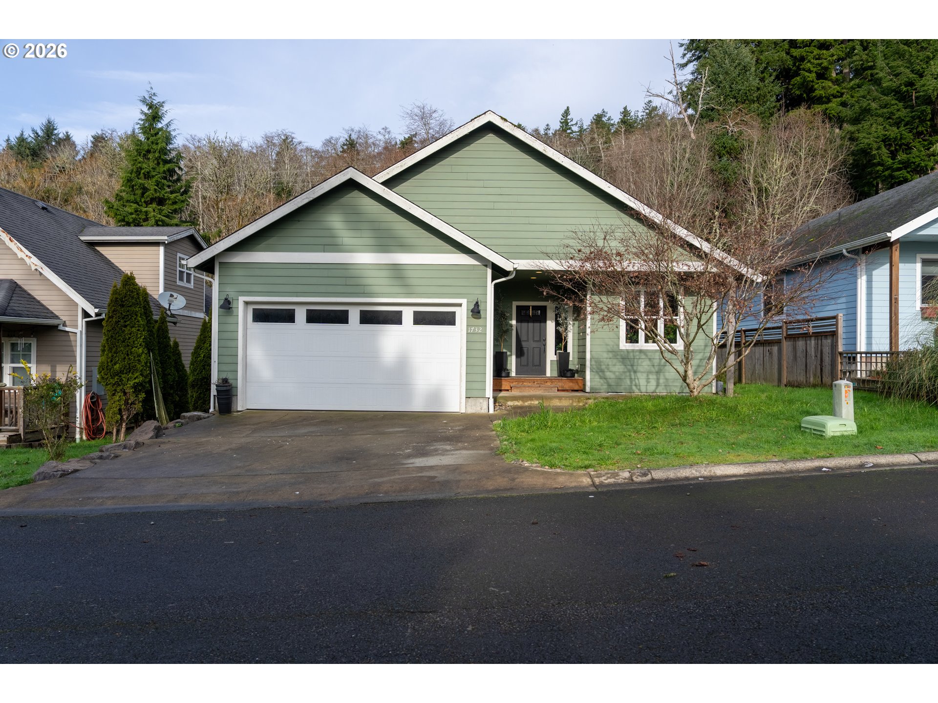 1732 Southeast 3rd Street Astoria, OR 97103 - Photo 4 of 30 a front view of a house with a yard and garage