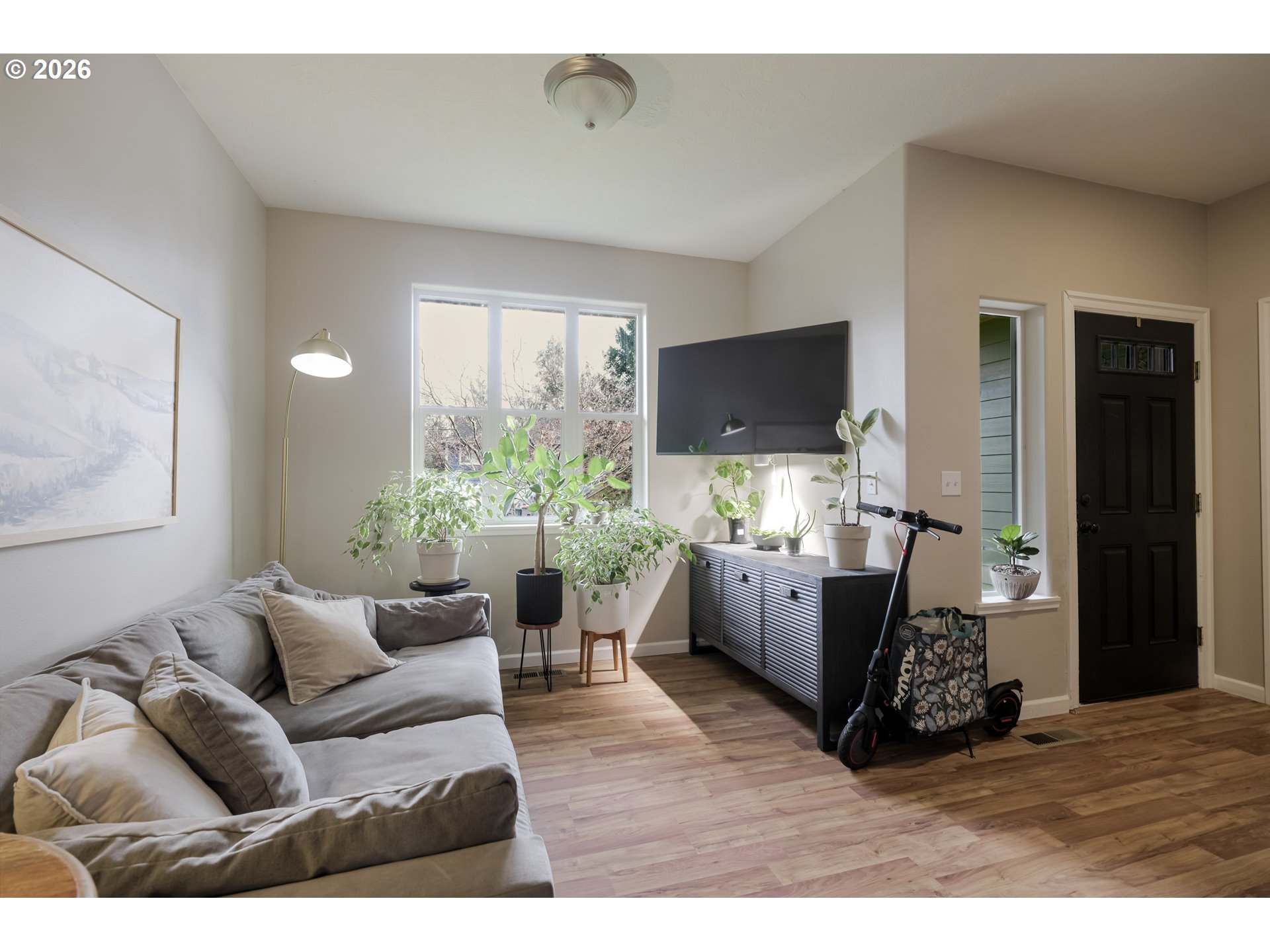 1732 Southeast 3rd Street Astoria, OR 97103 - Photo 6 of 30 a living room with furniture and a flat screen tv