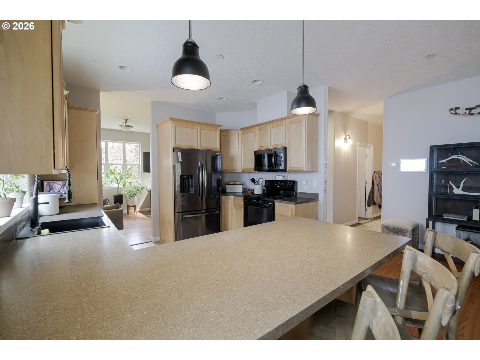 1732 Southeast 3rd Street Astoria, OR 97103 - Photo 9 of 30 a kitchen with kitchen island a stove and a refrigerator