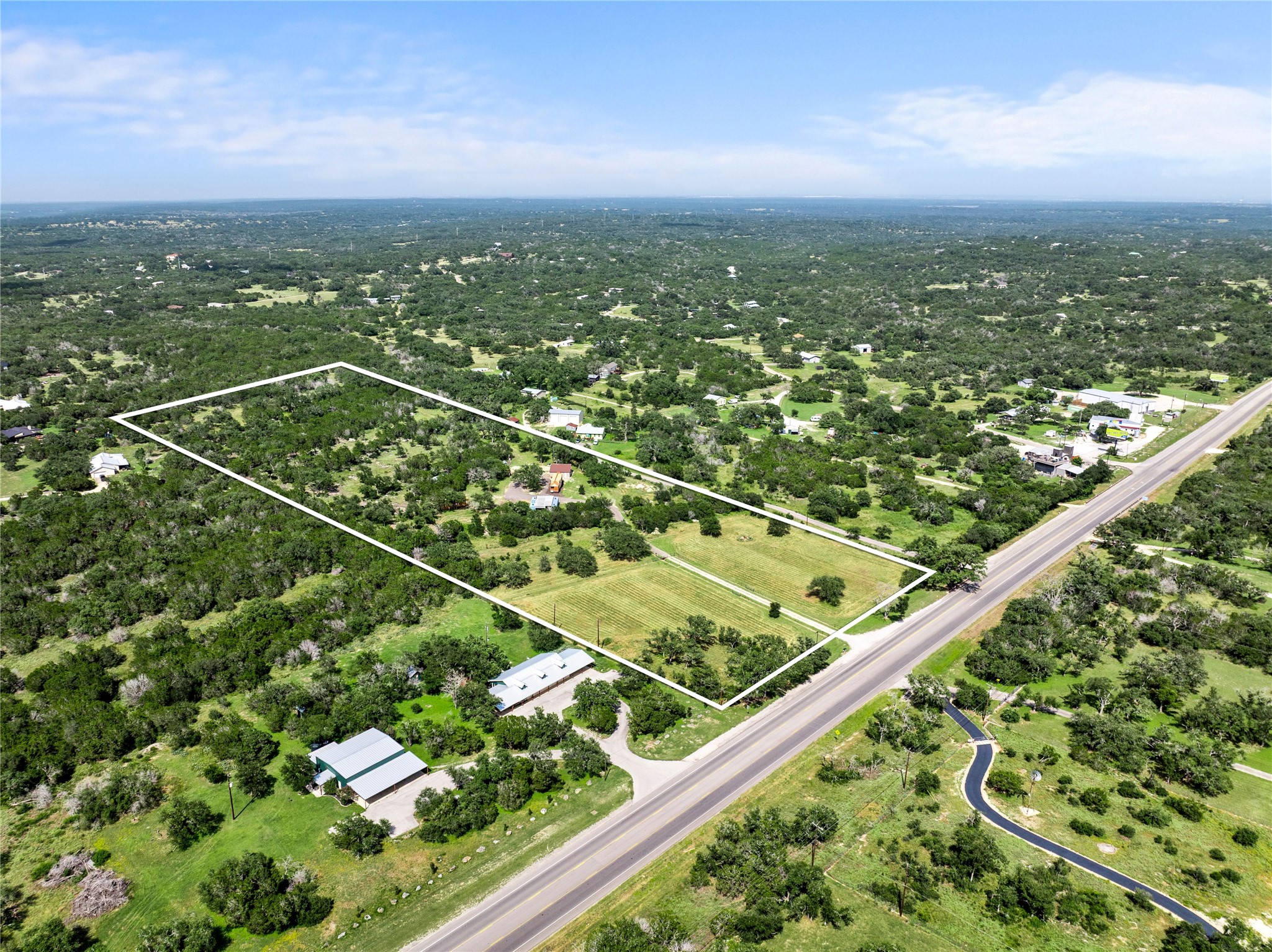 8200 Ranch Road 12 San Marcos, TX 78666 - Photo 2 of 40 A sprawling rural landscape offers abundant space for diverse possibilities.