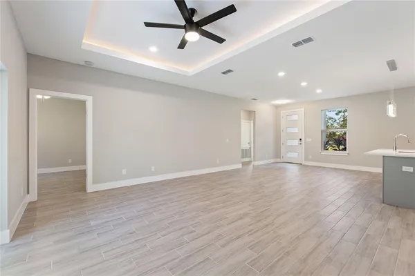 a view of kitchen with cabinets and wooden floor