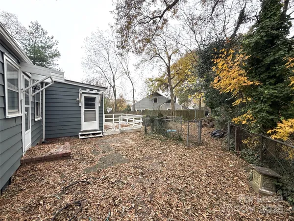 a backyard of a house with lots of green space