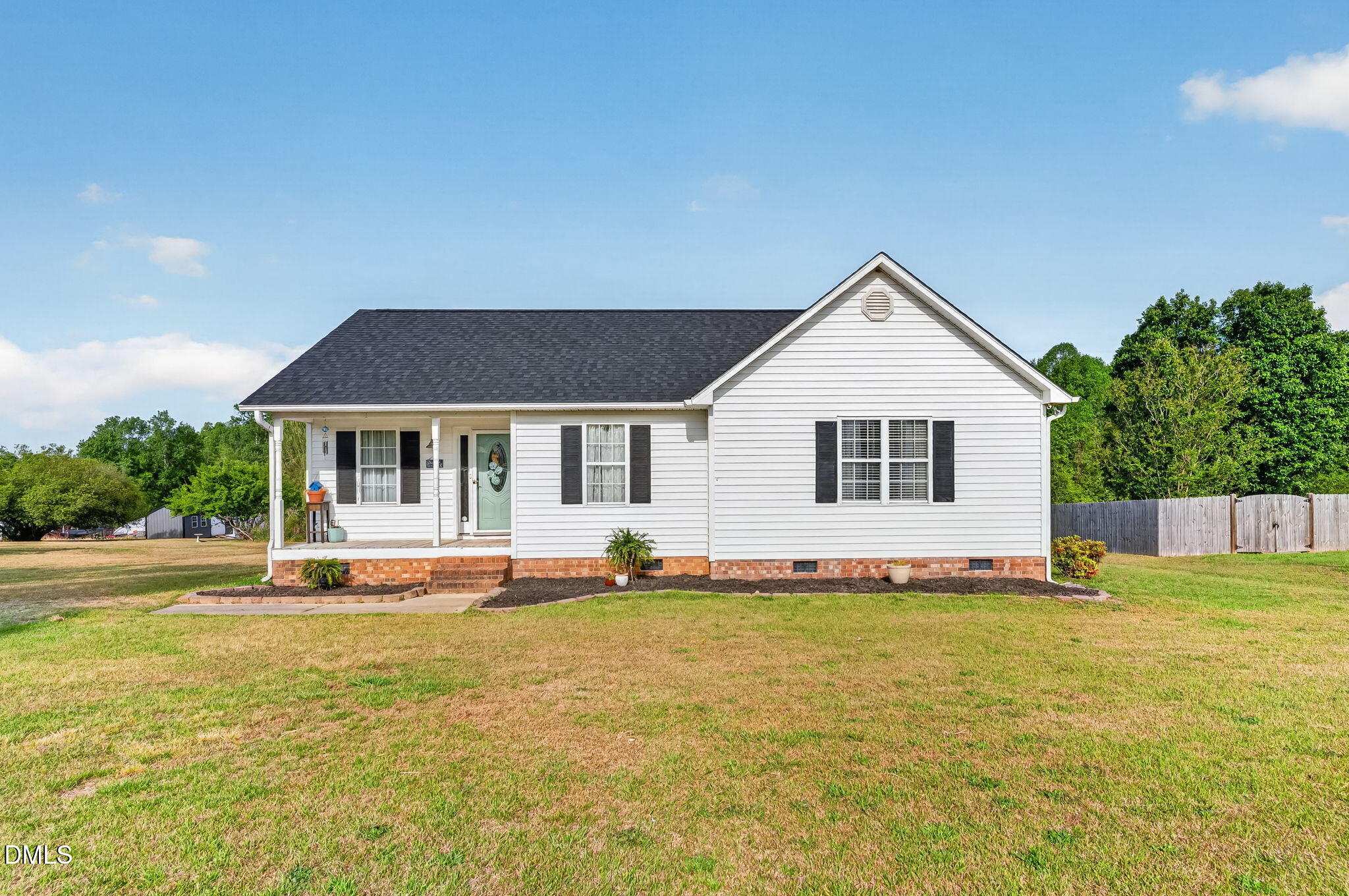 1101 Live Oak Road Coats, NC 27521 - Photo 29 of 29 a front view of house with yard and trees in the background