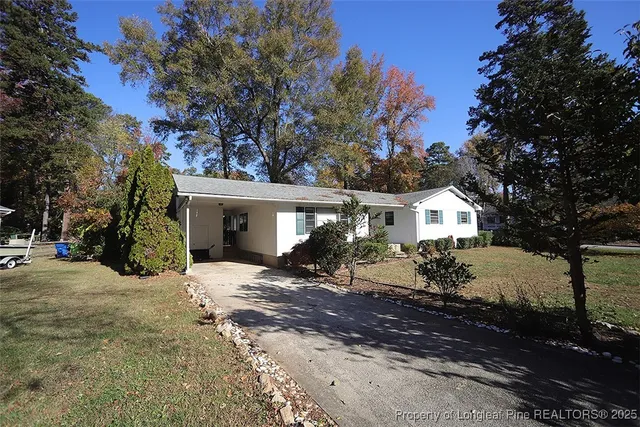 a view of a house with a snow in the yard