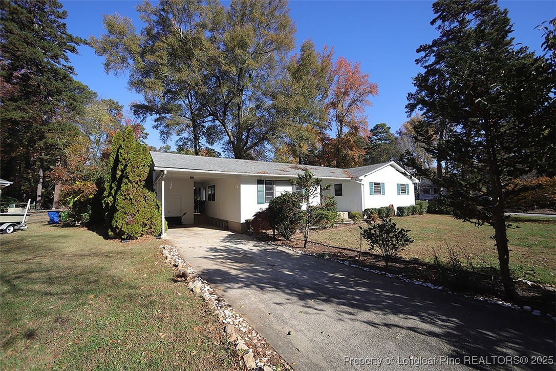 a view of a house with a snow in the yard