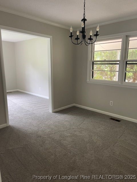 5509 Old Forge Circle Raleigh, NC 27609 - Photo 4 of 8 en empty room with windows and chandelier