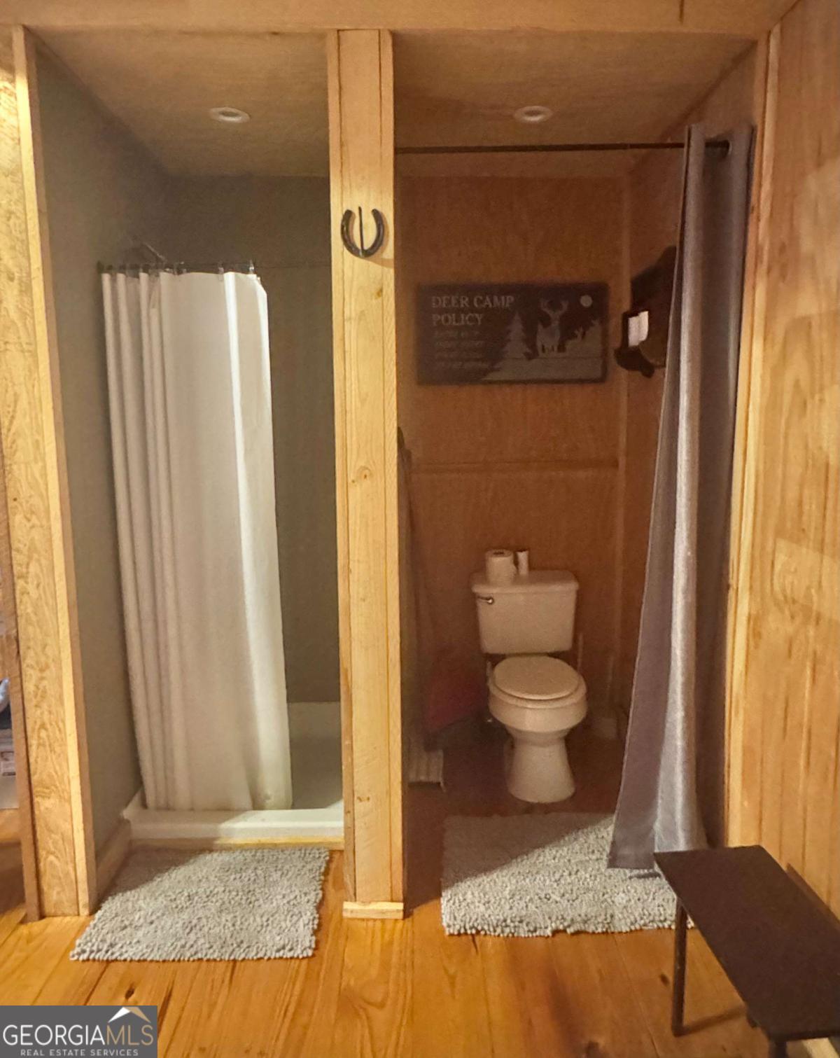 1603 Dl Durrence Road Reidsville, GA 30453 - Photo 14 of 78 a bathroom with a granite countertop toilet and a shower