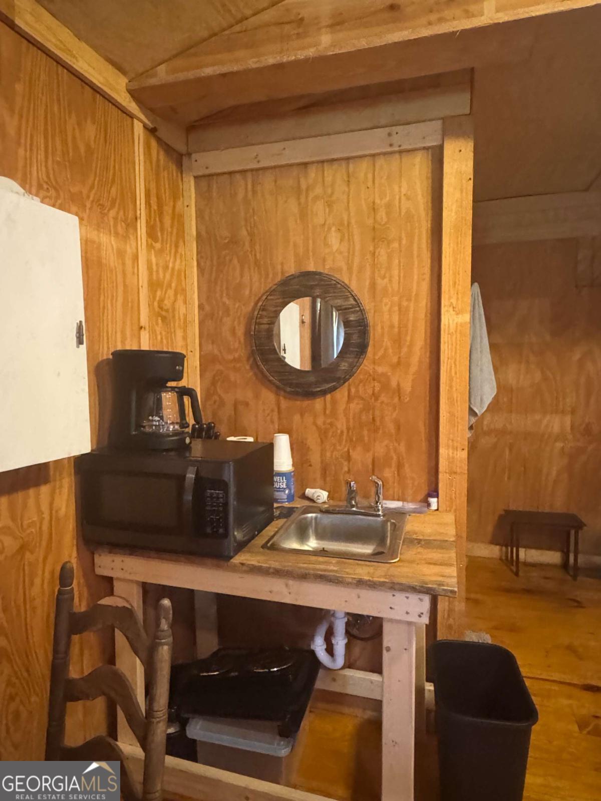 1603 Dl Durrence Road Reidsville, GA 30453 - Photo 15 of 78 a bathroom with a sink a mirror and a bathtub