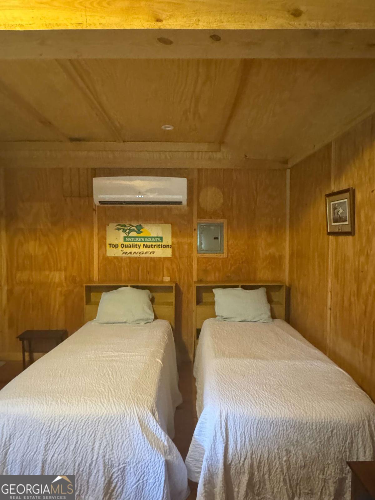 1603 Dl Durrence Road Reidsville, GA 30453 - Photo 16 of 78 a bedroom with two beds and a night stand