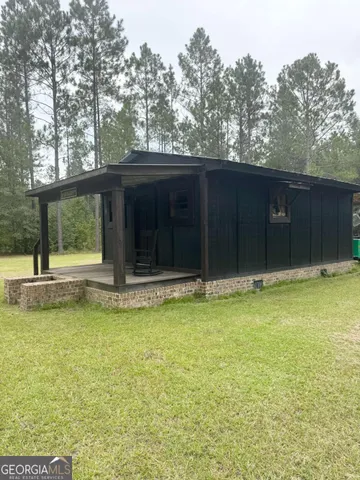 a bathroom with a granite countertop toilet and a shower