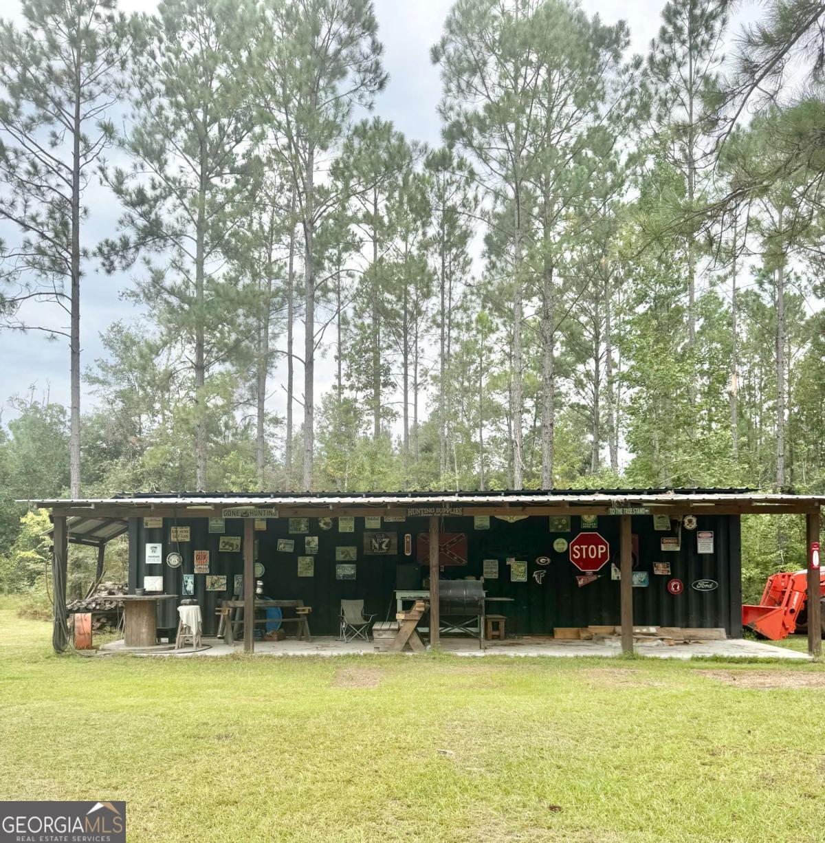 1603 Dl Durrence Road Reidsville, GA 30453 - Photo 9 of 78 a view of a swimming pool with seating space