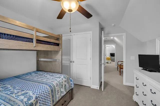 a bedroom with a bed and a tv