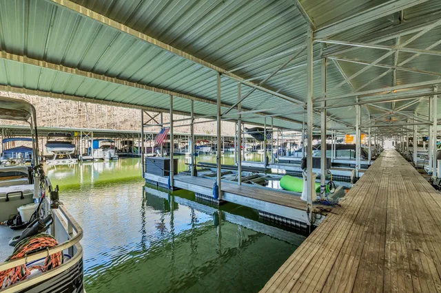 a view of a house with a wooden deck