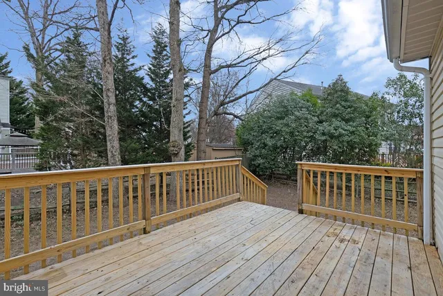 a view of wooden deck and a yard