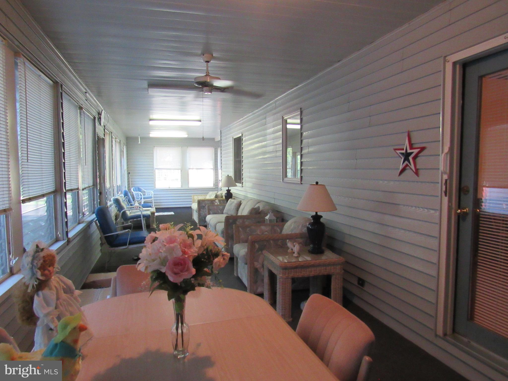 22173 Atlanta Road Seaford, DE 19973 - Photo 28 of 58 HUGE wrap around enclosed porch