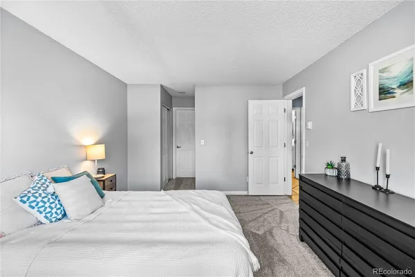 a bed room with a bed and a chandelier