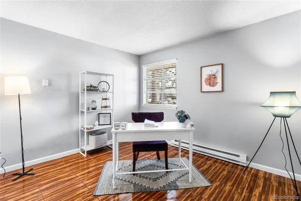 a bedroom with a bed and a table in it