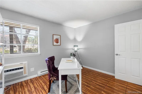 a view of a livingroom with furniture and wooden floor
