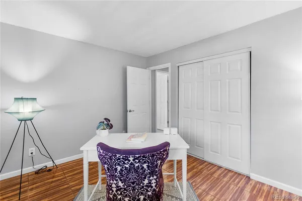 a porch with a bench in front of it