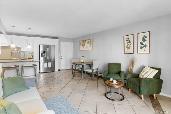 a living room with furniture and a table