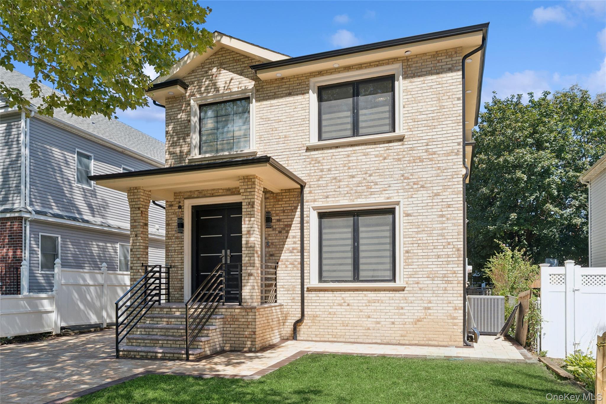 81-25 265th Street Queens, NY 11004 - Photo 2 of 44 View of front of house with brick siding
