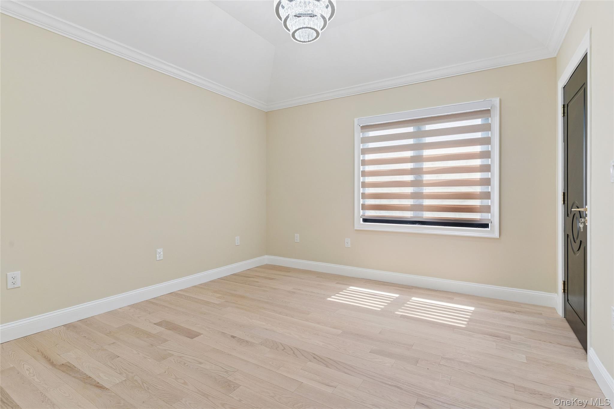 81-25 265th Street Queens, NY 11004 - Photo 26 of 44 Second floor bedroom 2 with ornamental molding, light wood-style floors, and a closet