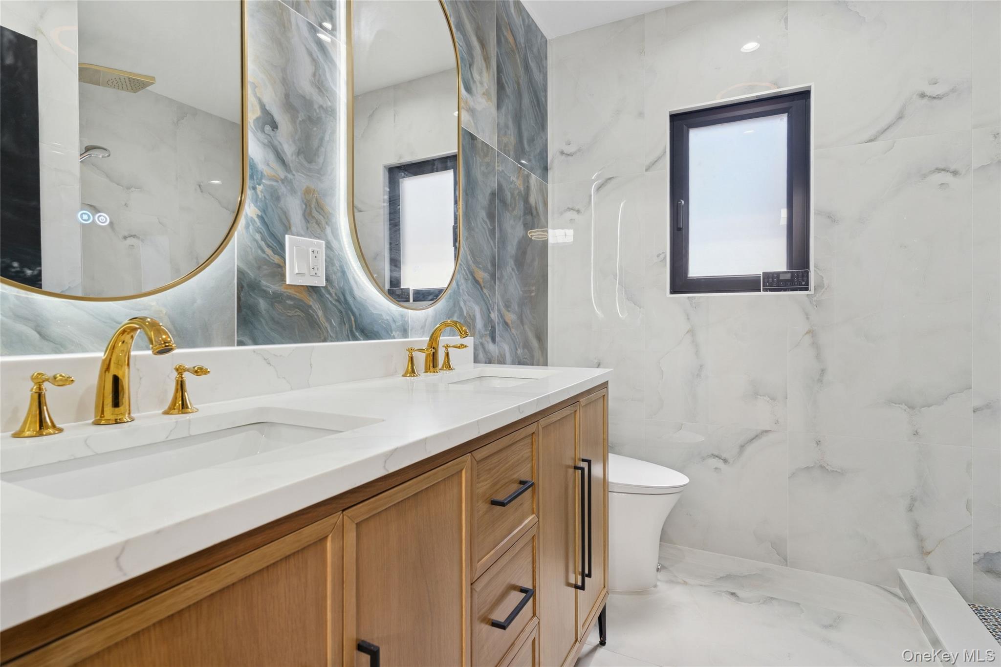 81-25 265th Street Queens, NY 11004 - Photo 30 of 44 En suite Bathroom featuring double vanity, tile walls, smart mirrors, smart toilet, and shower jet