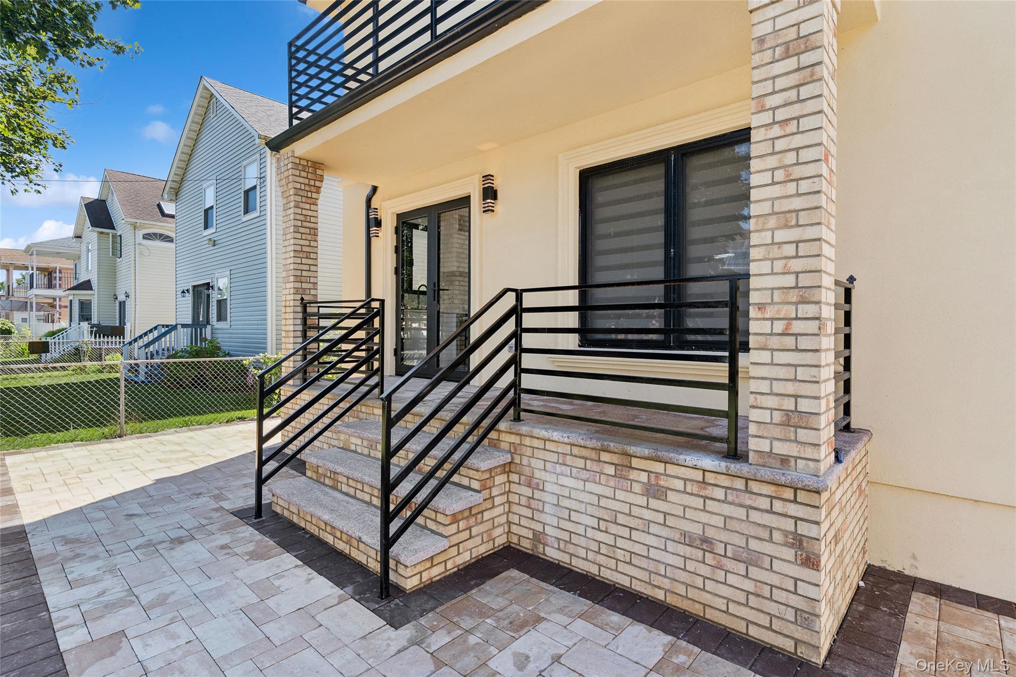 81-25 265th Street Queens, NY 11004 - Photo 7 of 44 Patio area in backyard leading to kitchen