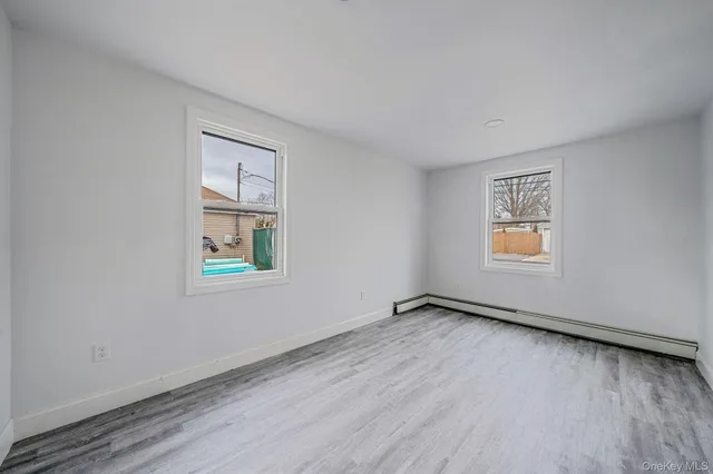 a white toilet sitting next to a bath tub