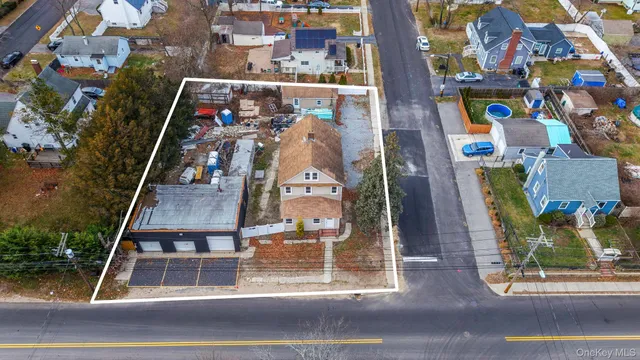 an aerial view of houses with outdoor space
