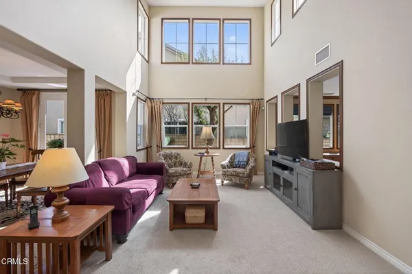 a view of a kitchen with wooden cabinets and a stove top oven
