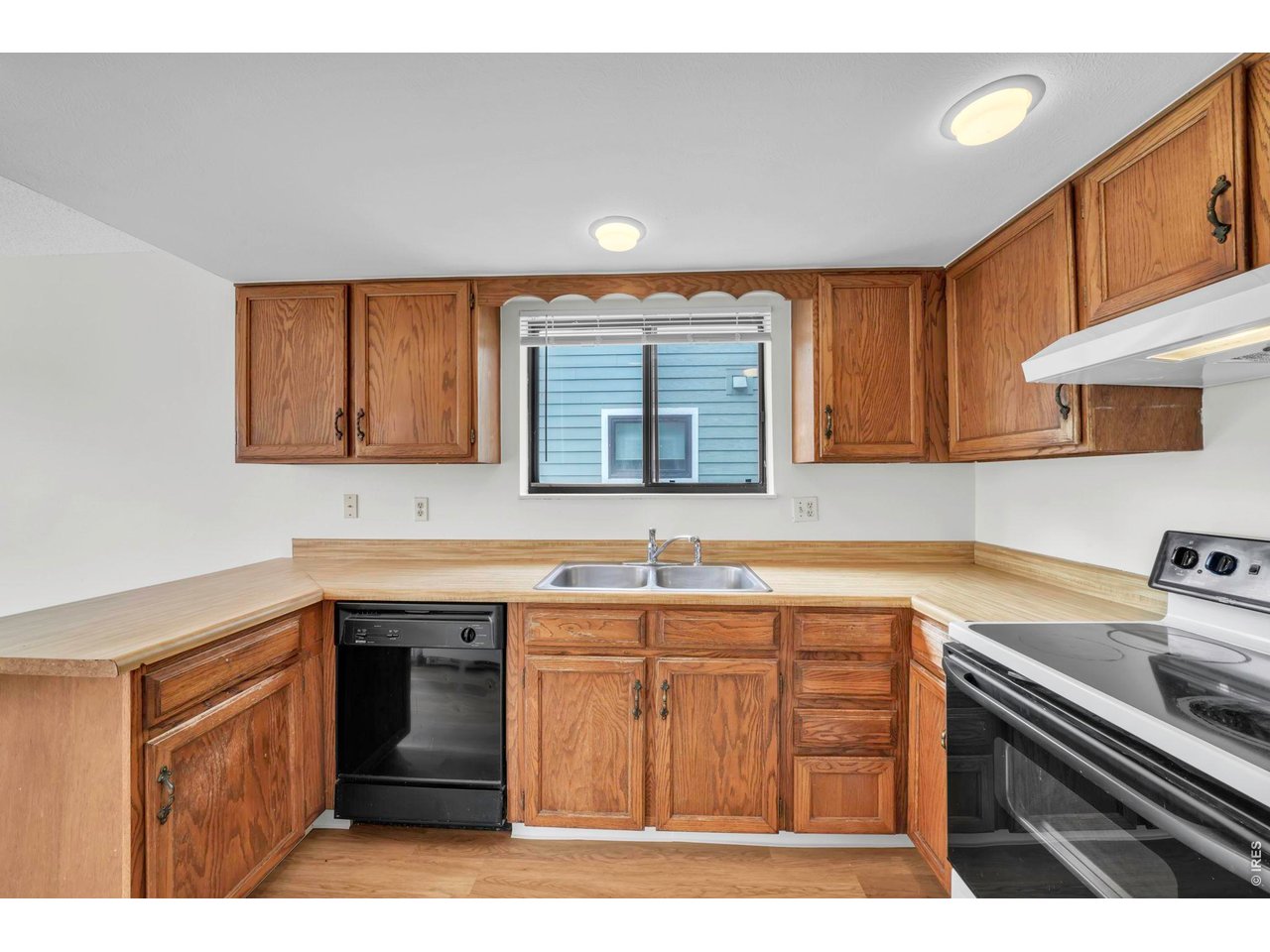 4268 Corriente Place Boulder, CO 80301 - Photo 11 of 35 a kitchen with stainless steel appliances granite countertop a sink stove and cabinets