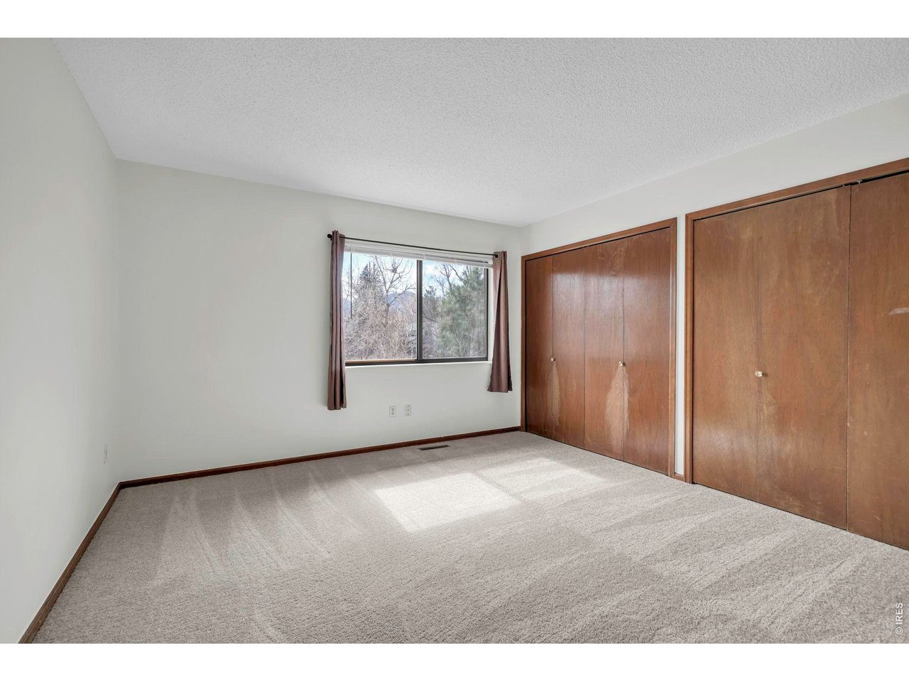 4268 Corriente Place Boulder, CO 80301 - Photo 19 of 35 an empty room with windows