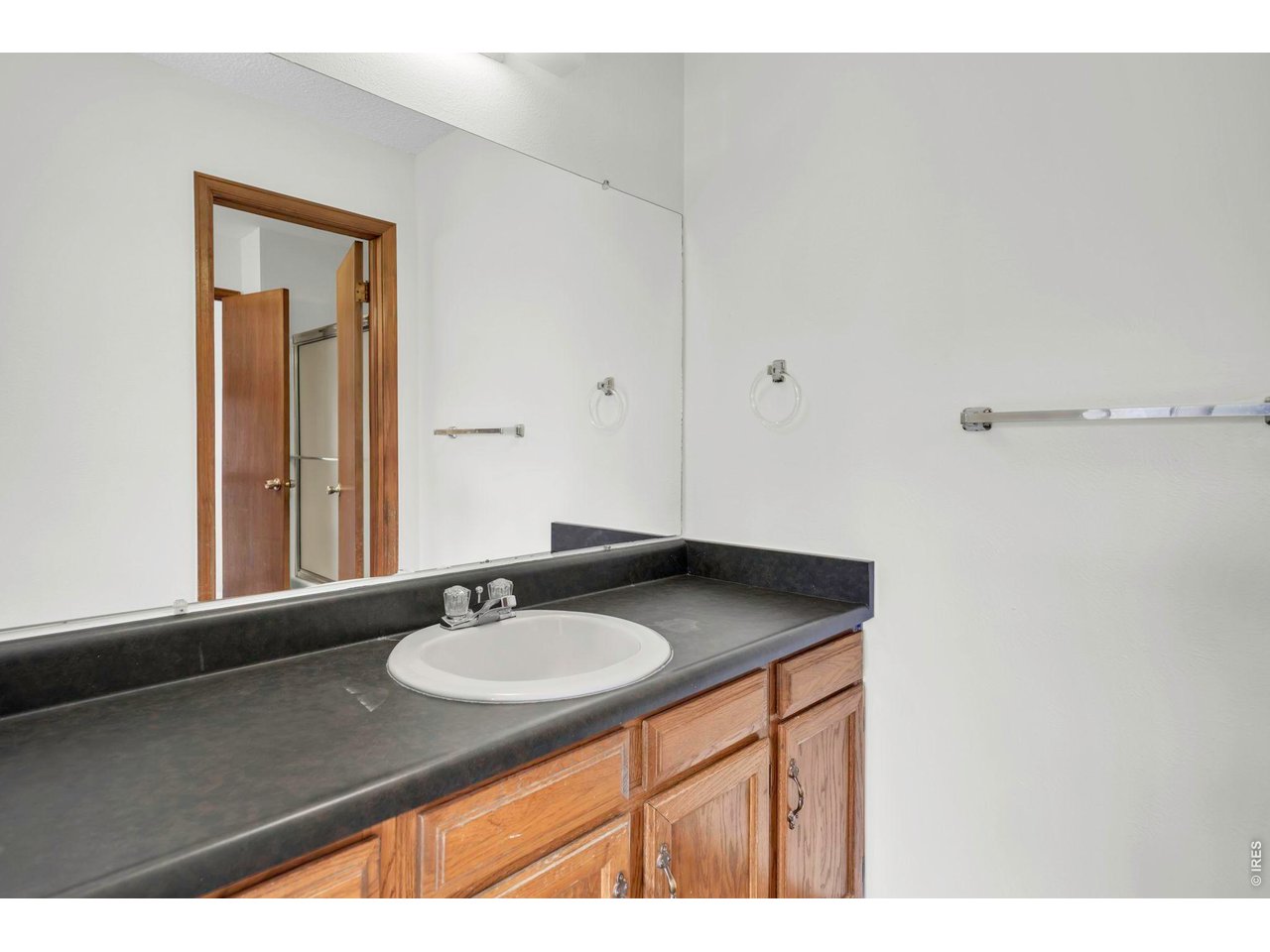 4268 Corriente Place Boulder, CO 80301 - Photo 20 of 35 a bathroom with a granite countertop sink and a mirror