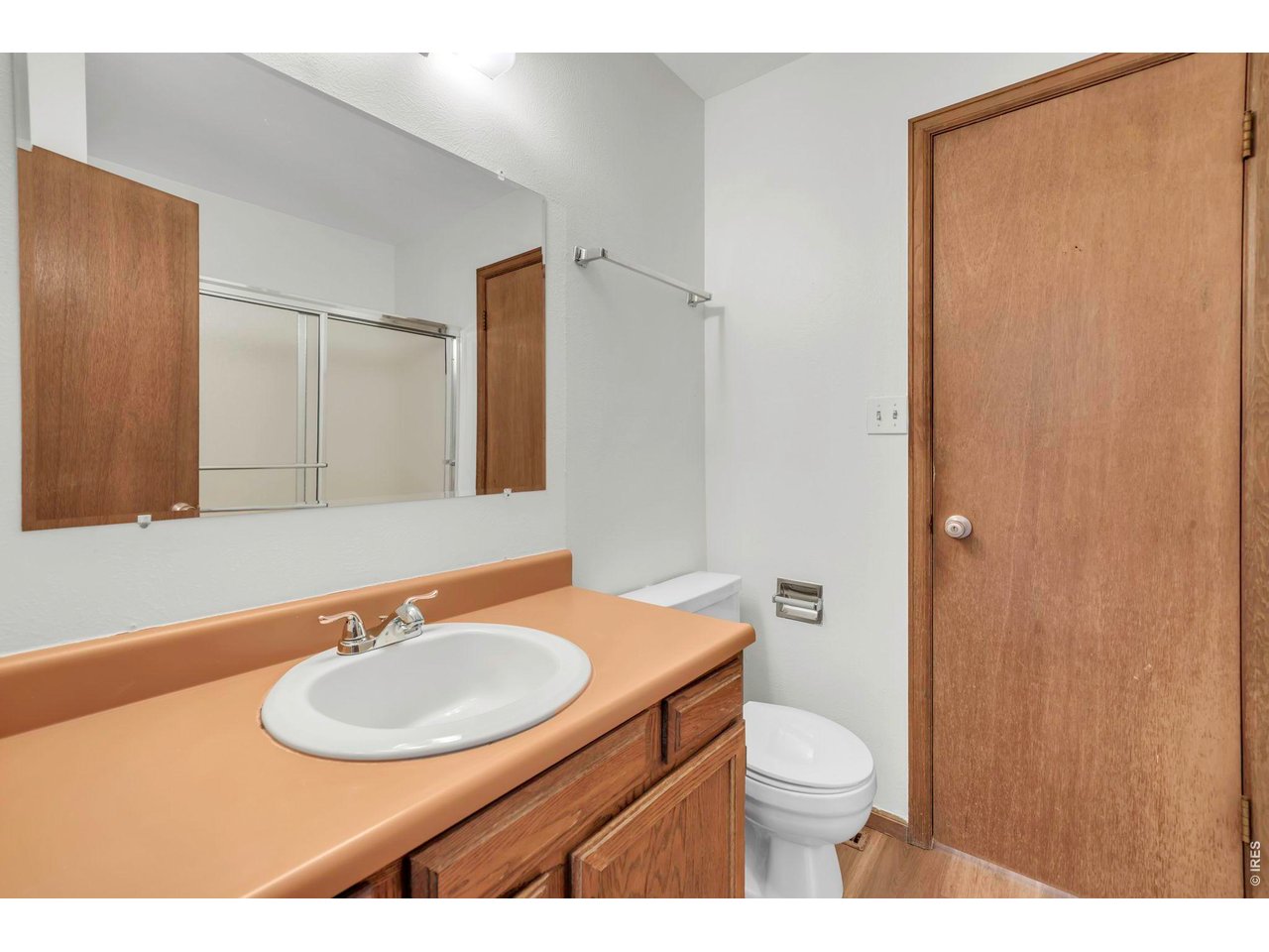 4268 Corriente Place Boulder, CO 80301 - Photo 22 of 35 a bathroom with a sink a toilet and mirror