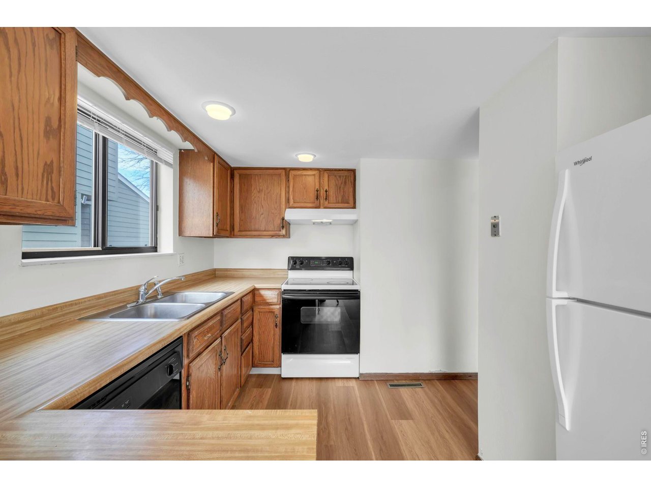 4268 Corriente Place Boulder, CO 80301 - Photo 9 of 35 a kitchen with granite countertop a refrigerator stove and sink