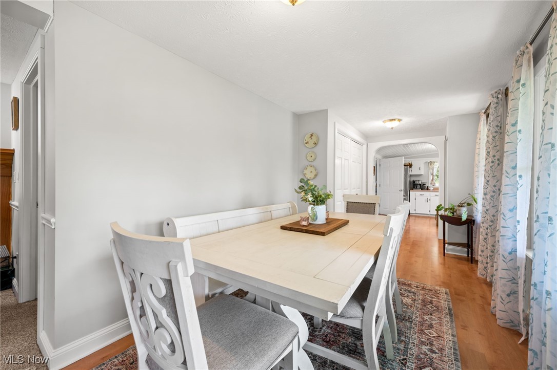 3945 Columbia Road Medina, OH 44256 - Photo 11 of 40 Dining area featuring light wood-style flooring and arched walkways